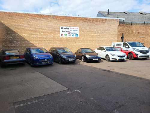 vauxhalls parked outside our garage